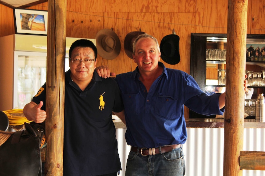 Close shot of Sino-Australia Top Beef Chairman Mr Zhang Yong and Billy Hayes from central Australia's Deepwell cattle station