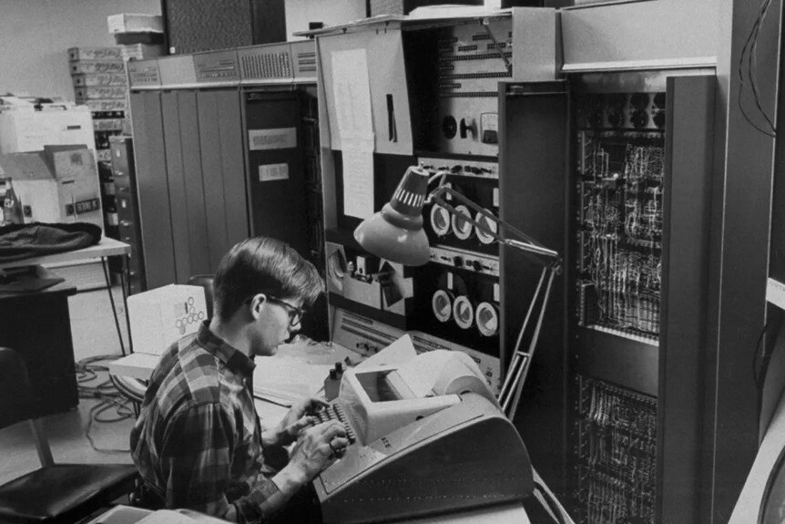 An MIT student using an early digital computer in 1966