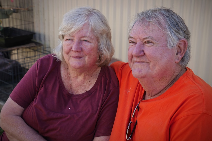 An older looking woman and man smiling