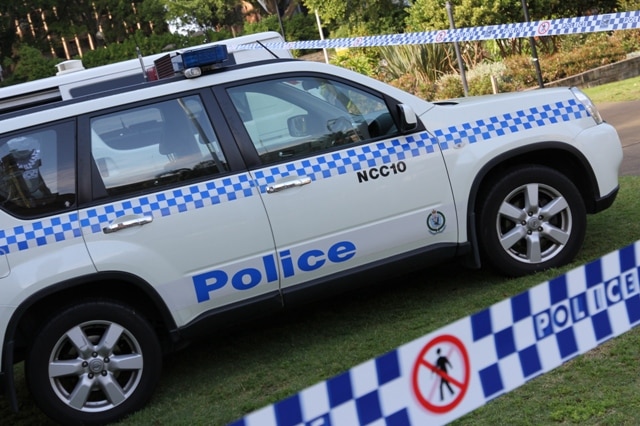 A man has been charged after allegedly attacking neighbours with a samurai sword.
