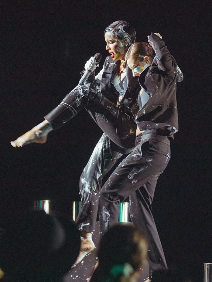 Two female performers on stage.