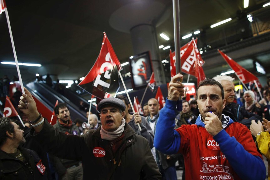 Workers on strike in Madrid join protest