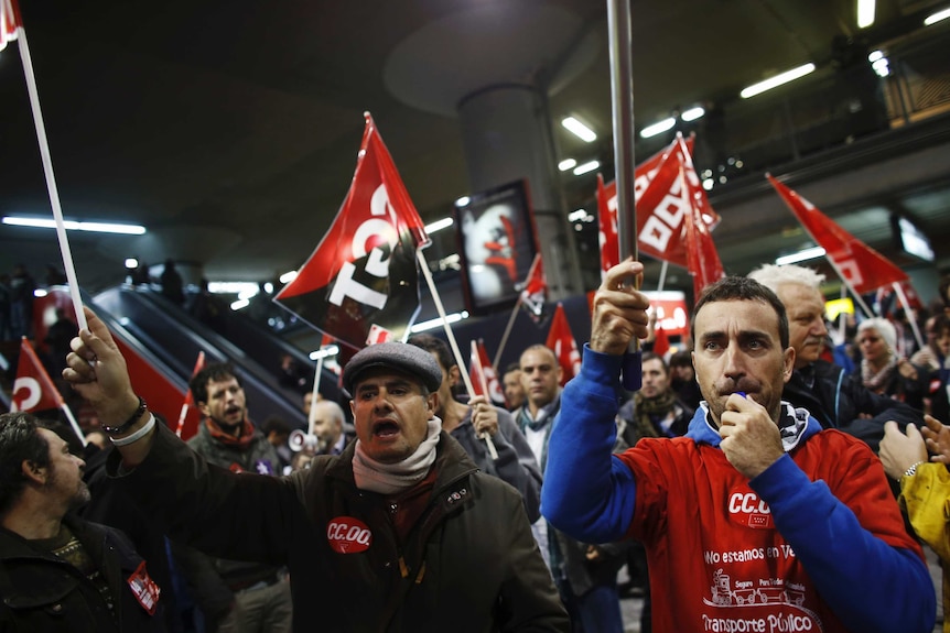 Workers on strike in Madrid join protest