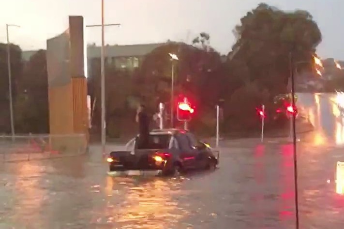 A partly submerged car.