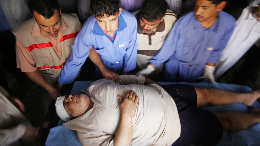 A man wounded in a bomb attack is treated at a hospital in Kerbala, 110 kilometres south of Baghdad.