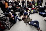 Stranded passengers wait at London St Pancras Eurostar terminal