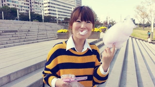 Eunhee Park holds up fairy floss to the camera