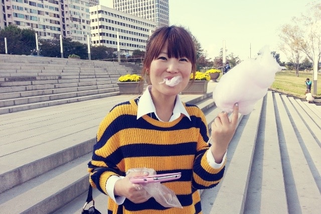 Eunhee Park holds up fairy floss to the camera