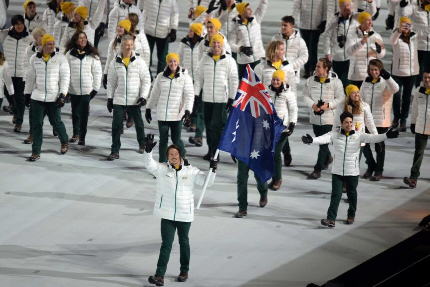 Australia's Alex Pullin (front) carries the flag at Sochi Winter Olympics Opening Ceremony in 2014.
