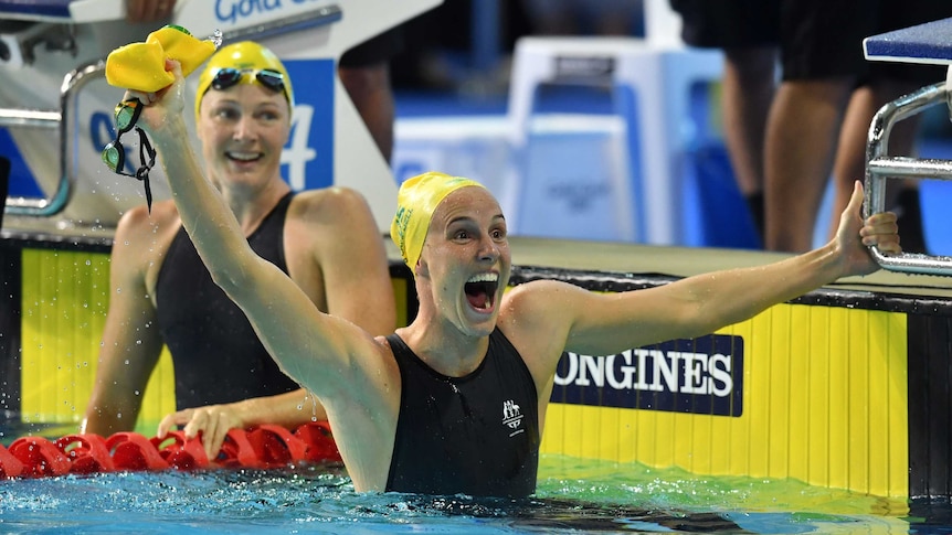 Australia's Bronte Campbell (R) celebrates, as Cate Campbell looks on after women's 100m freestyle.