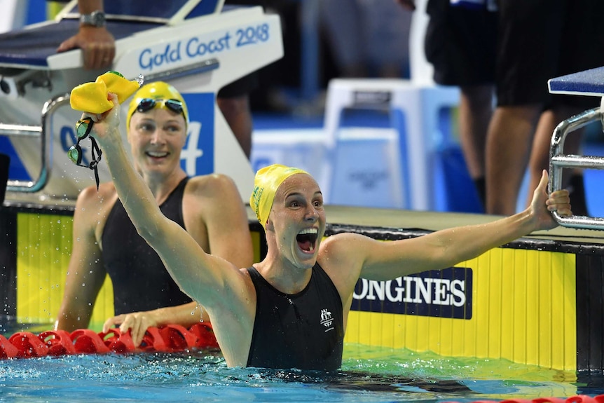 Australia's Bronte Campbell (R) celebrates, as Cate Campbell looks on after women's 100m freestyle.