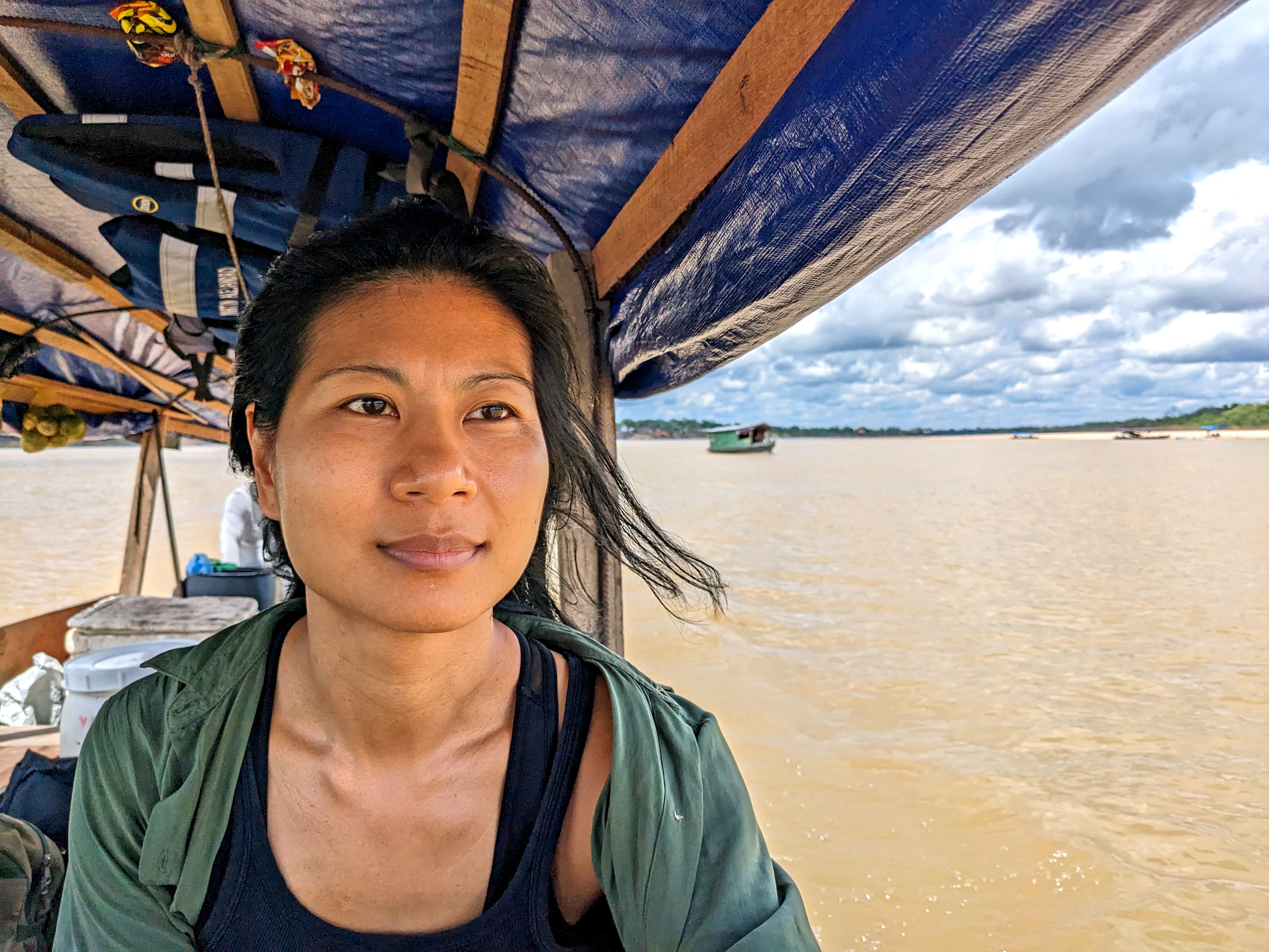 Inga looks out from a boat cruising down Colombia's Amazon