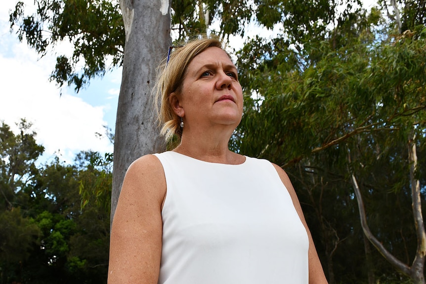 Koala advocate Debbie Pointing stands under a tree near Toondah Harbour in Redlands, east of Brisbane.