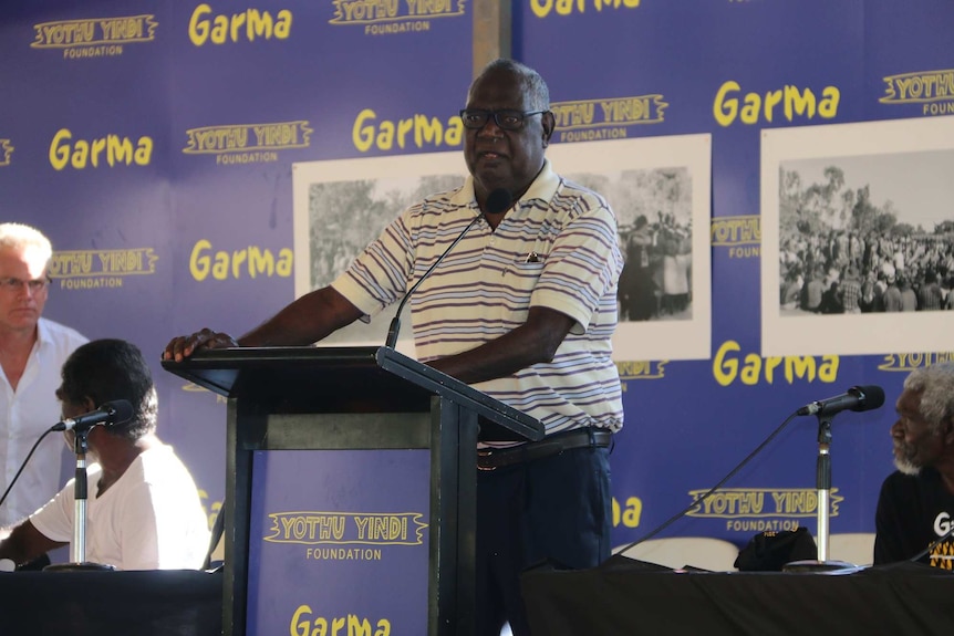 Galarrwuy Yunupingu speaks at a podium at the 2016 Garma Festival.