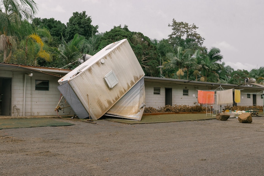 A caravan flipped upside down