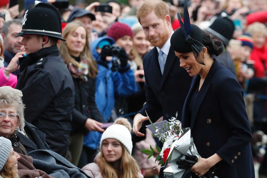Prince Harry and Meghan, Duchess of Sussex meet members of the crowd