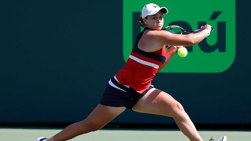 Ash Barty reaches for a backhand against Eugenie Bouchard at the Miami Open.
