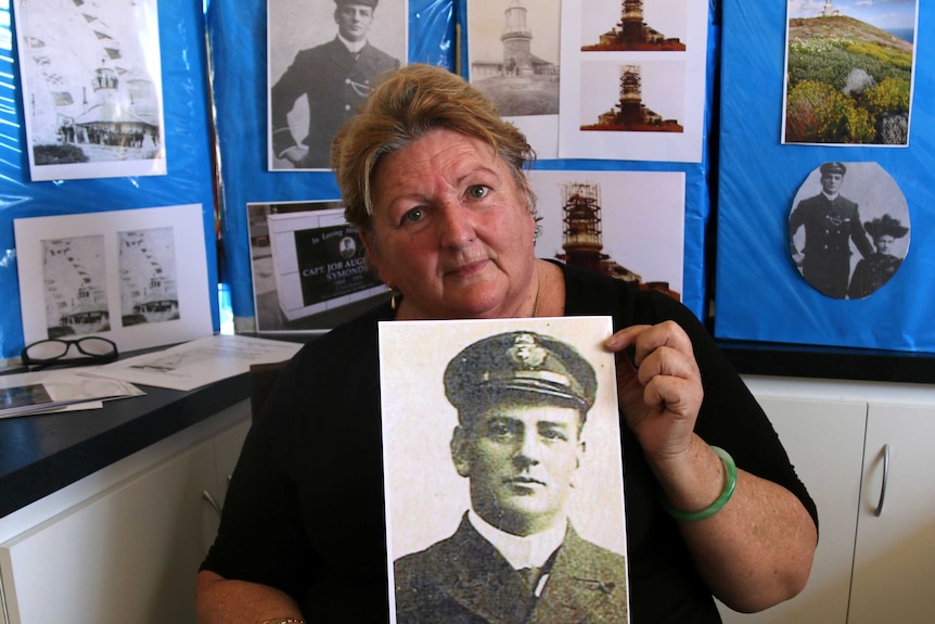 Laura Player holds a photo of her great grandfather Job Augustus Symonds.