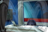 Emptry ABC TV news studio with ABC logo/'worm' superimposed/ghosted onto it