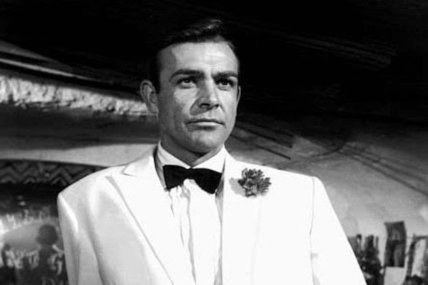 A black and white image of Sean Connery in a dinner suit