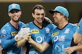 Steve Parry (C) of the Heat celebrates with team mates after taking the wicket of Travis Birt of the Hurricanes during the Big Bash League match