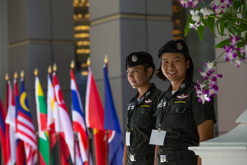 Police officers stand guard close to the venue of the ASEAN leaders summit in Bangkok.