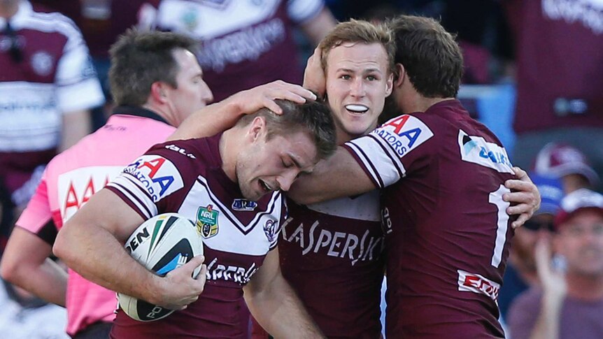 Manly celebrate try against Titans