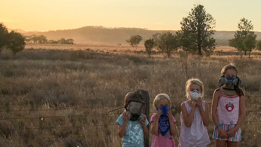 Pat Murphy's four daughters wear masks as they stand on their property on the Liverpool Plains in New South Wales.