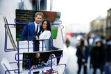 Merchandise depicting Britain's Prince Harry and Meghan, Duchess of Sussex, are seen on display in a souvenir shop.