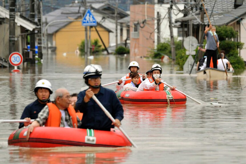 Residents are rescued by boat in Japan