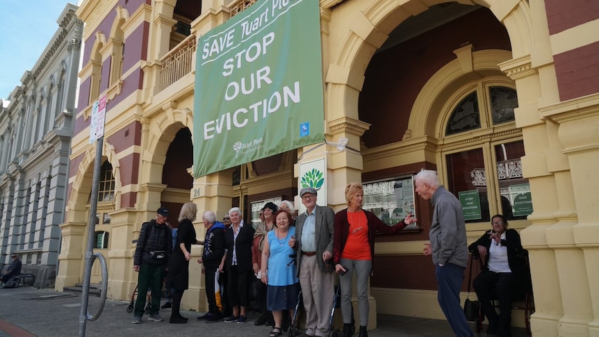 Tuart Place supporters in High Street Fremantle with a large banner