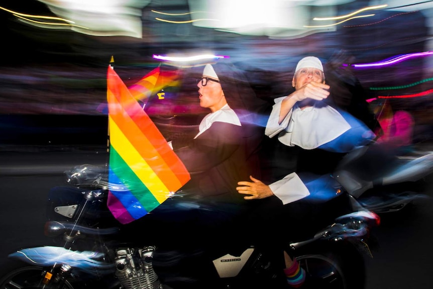 Two women on a motorbike