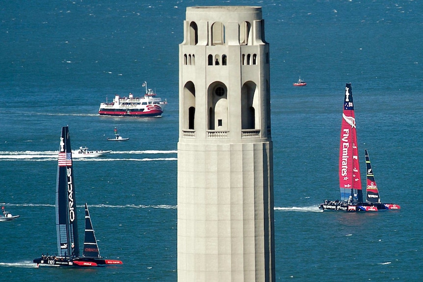 LtoR Oracle Team USA and Emirates Team New Zealand race across San Francisco Bay during race 11.