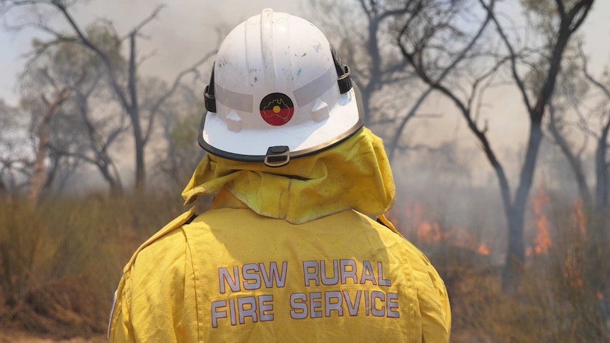 Looking at a fire fighter from behind