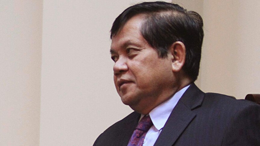 Cambodian Secretary of State at the Foreign Affairs Ministry, Ouch Borith, listens during a meeting.