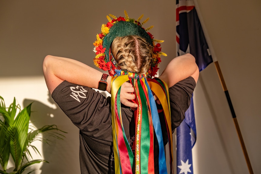 A series of colourful ribbons hanging from a head piece.