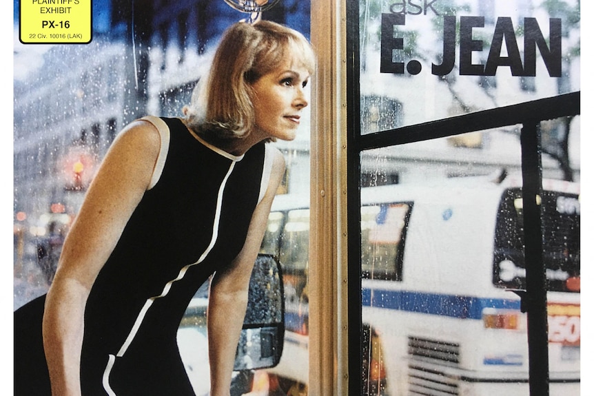 Blonde woman in a black dress with a white trim looks out a window that has E Jean emblazoned on it. Picture used on her column.