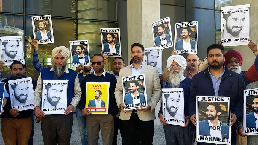 Friends and family of slain Brisbane bus driver Manmeet Alisher holding pictures of the dead man