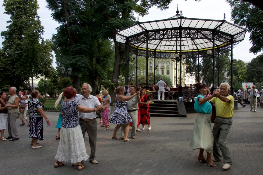 Pensioners dancing and wearing colourful clothing in Odessa, Ukraine.
