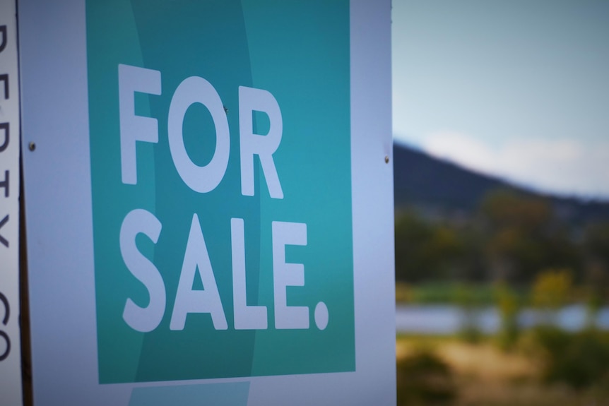 For Sale signage at a rural property.