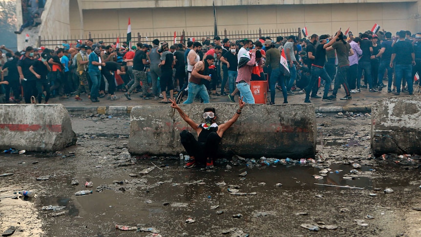 Iraqi protesters gather in Tahrir Square in Baghdad