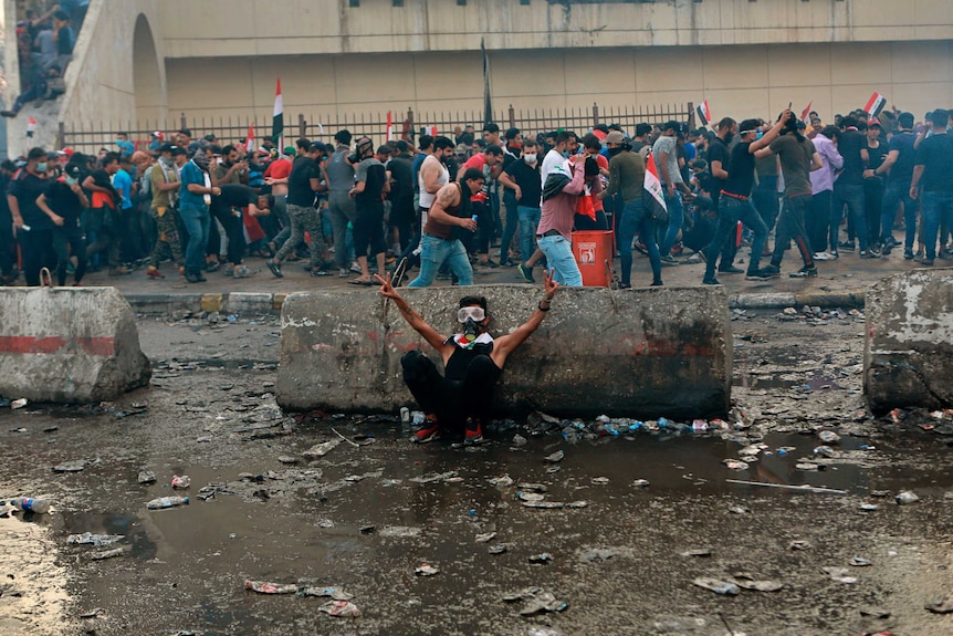 Iraqi protesters gather in Tahrir Square in Baghdad