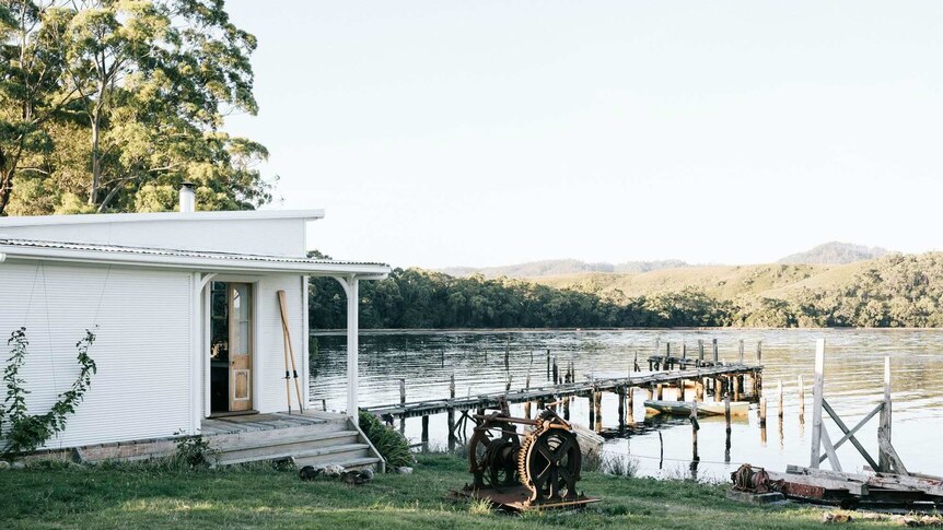 A boat shed with a jetty that extends far into the water