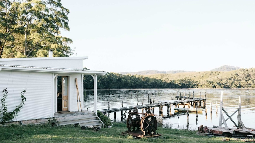 A boat shed with a jetty that extends far into the water