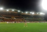 An Adelaide player on the field warming up during the women's AFL game