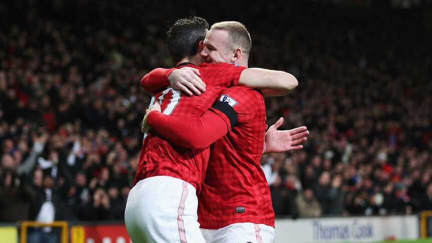 Quick start ... Robin van Persie (L) celebrates his early goal with Wayne Rooney