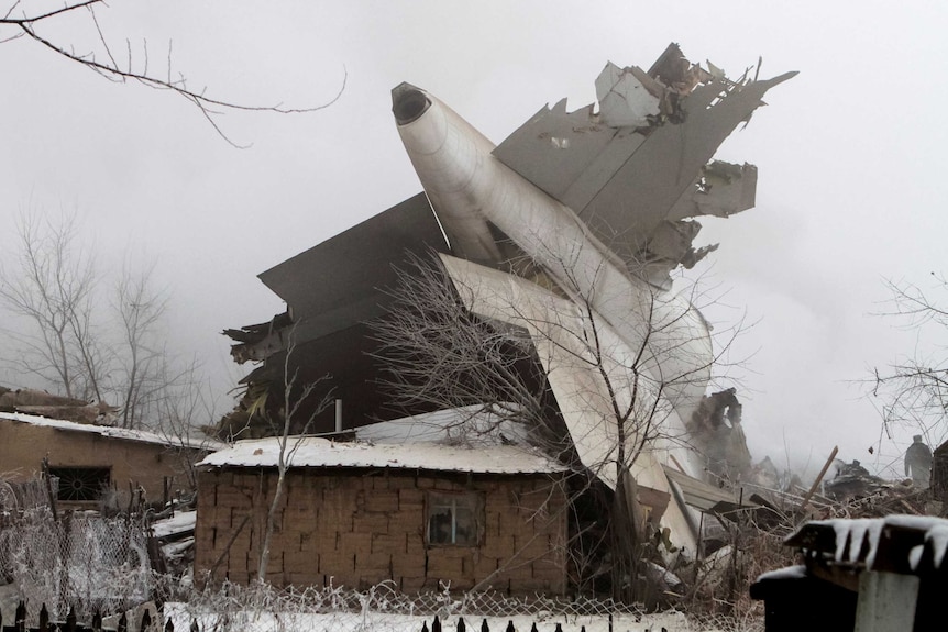 Plane debris is seen at the crash site of a Turkish cargo jet near Kyrgyzstan's Manas airport outside Bishkek, January 16, 2017.