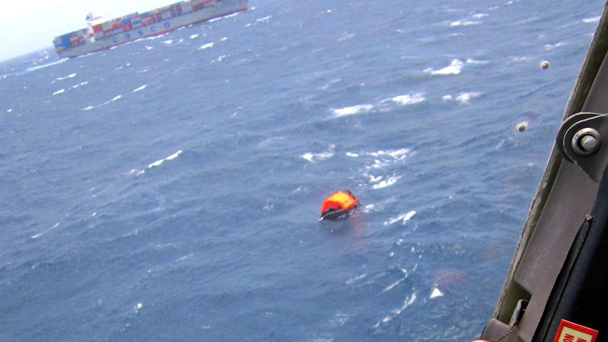 An inflatable life raft full of the survivors of the MV Rabaul Queen sinking drift in the ocean.