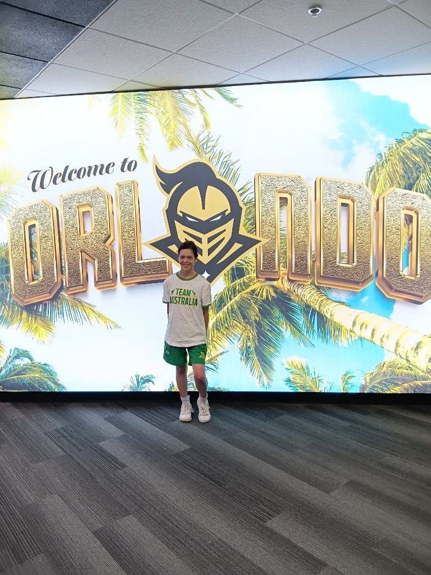 A teenage girl wearing a shirt that says 'team Australia'. 