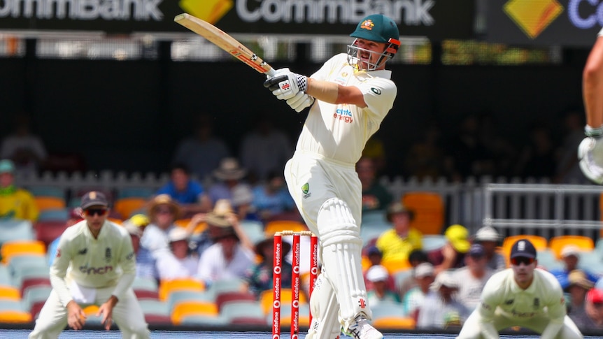 Australia batter Travis Head plays a pull shot on day three of the first Ashes Test at the Gabba.